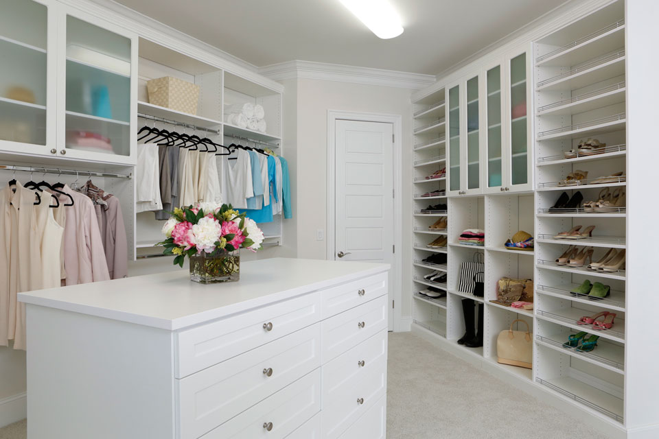 custom closet with island chest of drawers