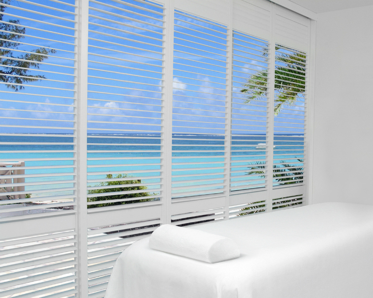 Palm Beach™ polysatin shutters with Lantana™ by Hunter Douglas are perfect for a beach house or cottage as they are not affected by moisture or water.