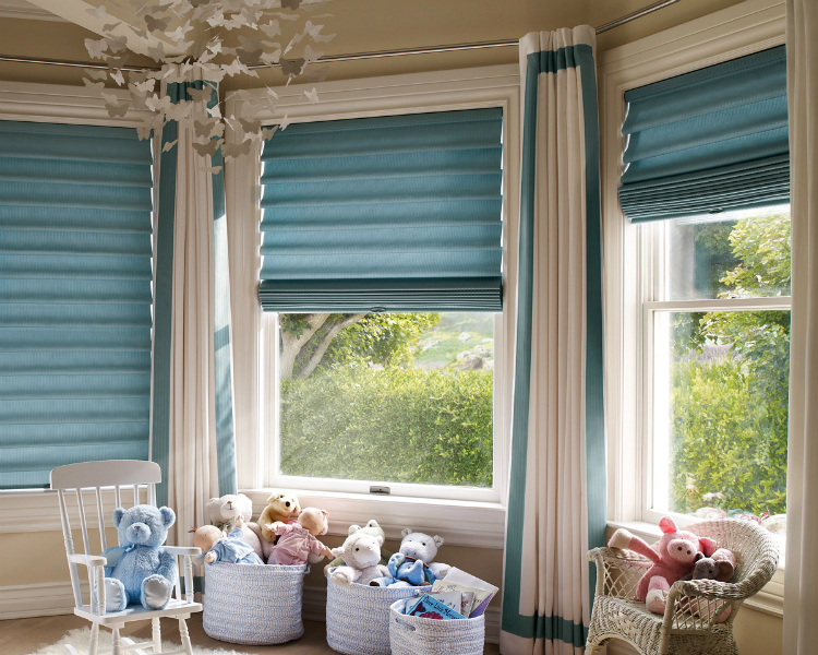 Vignette® Tiered™ Modern Roman Shades with LiteRise® by Hunter Douglas bring a pop of color to the kids' rooms.